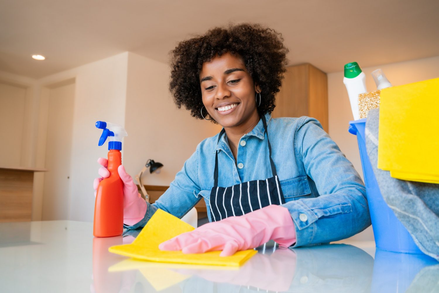 afro-woman-cleaning-new-home--e1616490867609.jpg